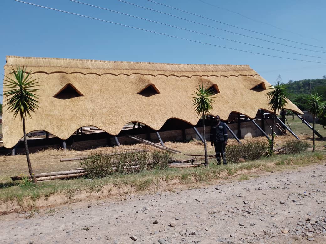 Luxury thatched roof camp at sunset
